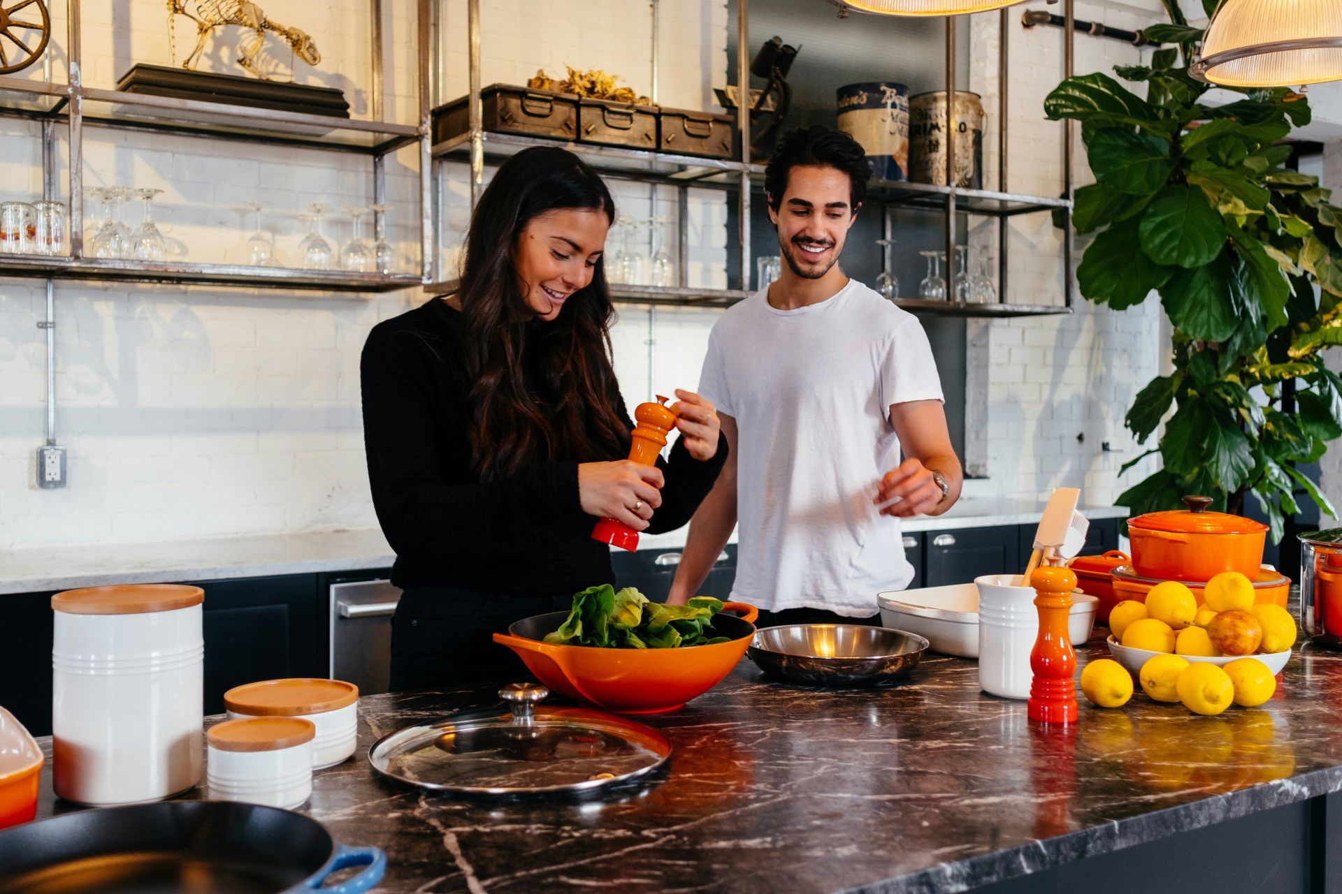 Top view of fresh vegetables and ingredients on a wooden table, perfect for healthy cooking inspiration.
